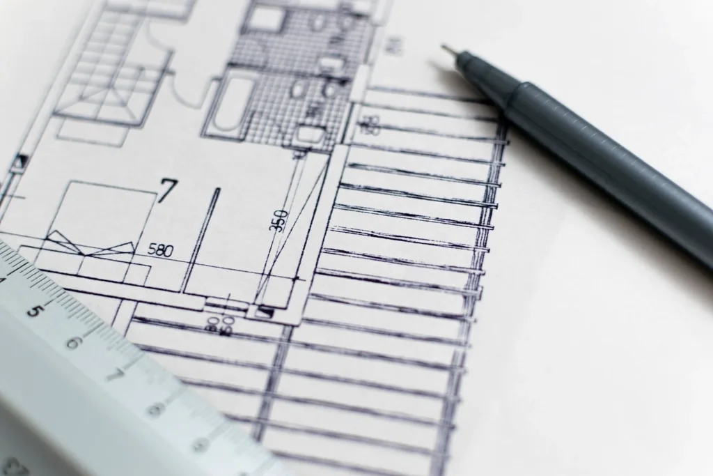 Architectural drawings with a pen and scale ruler